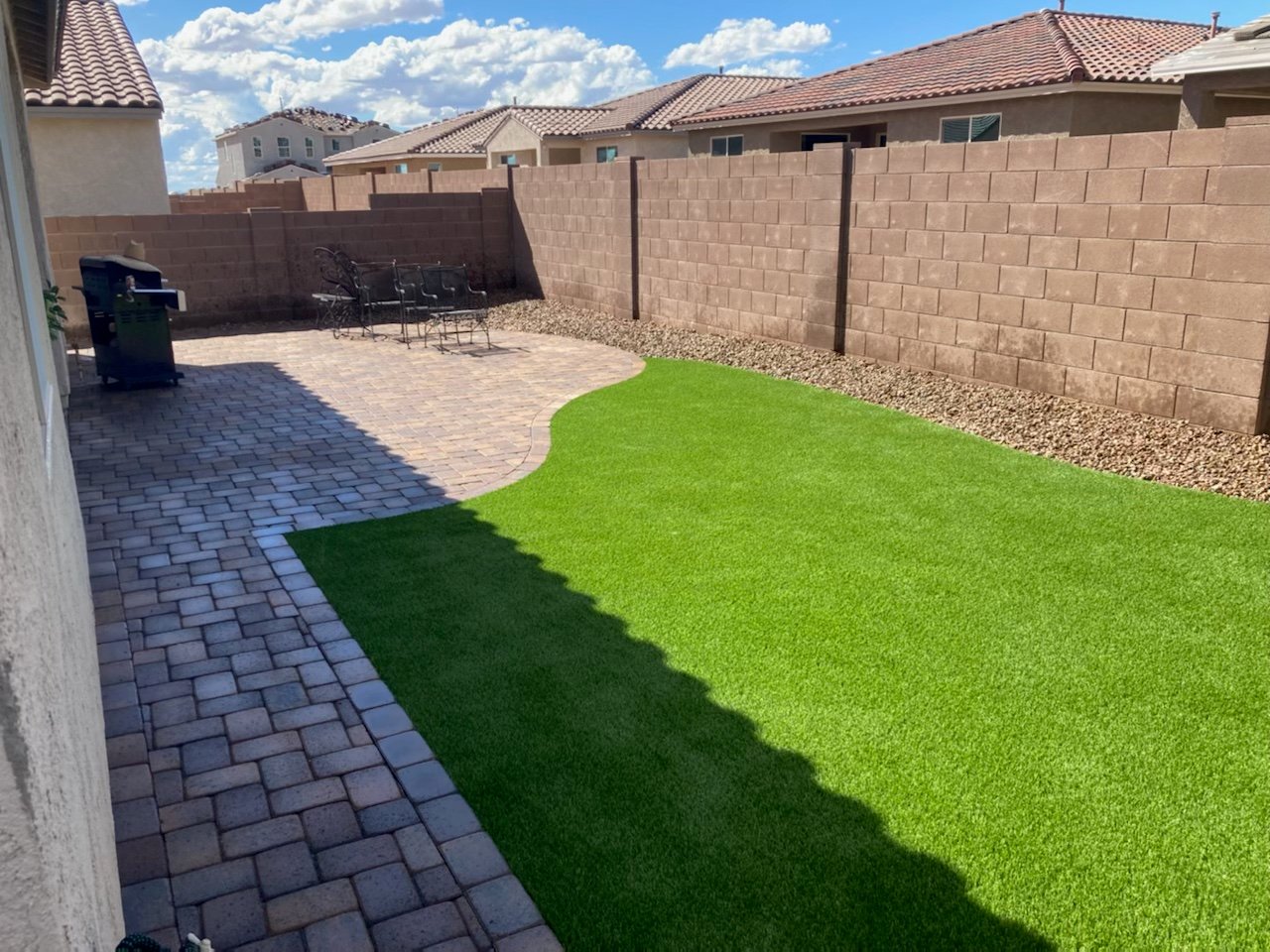 Residential artificial turf installation Tucson AZ backyard lawn design