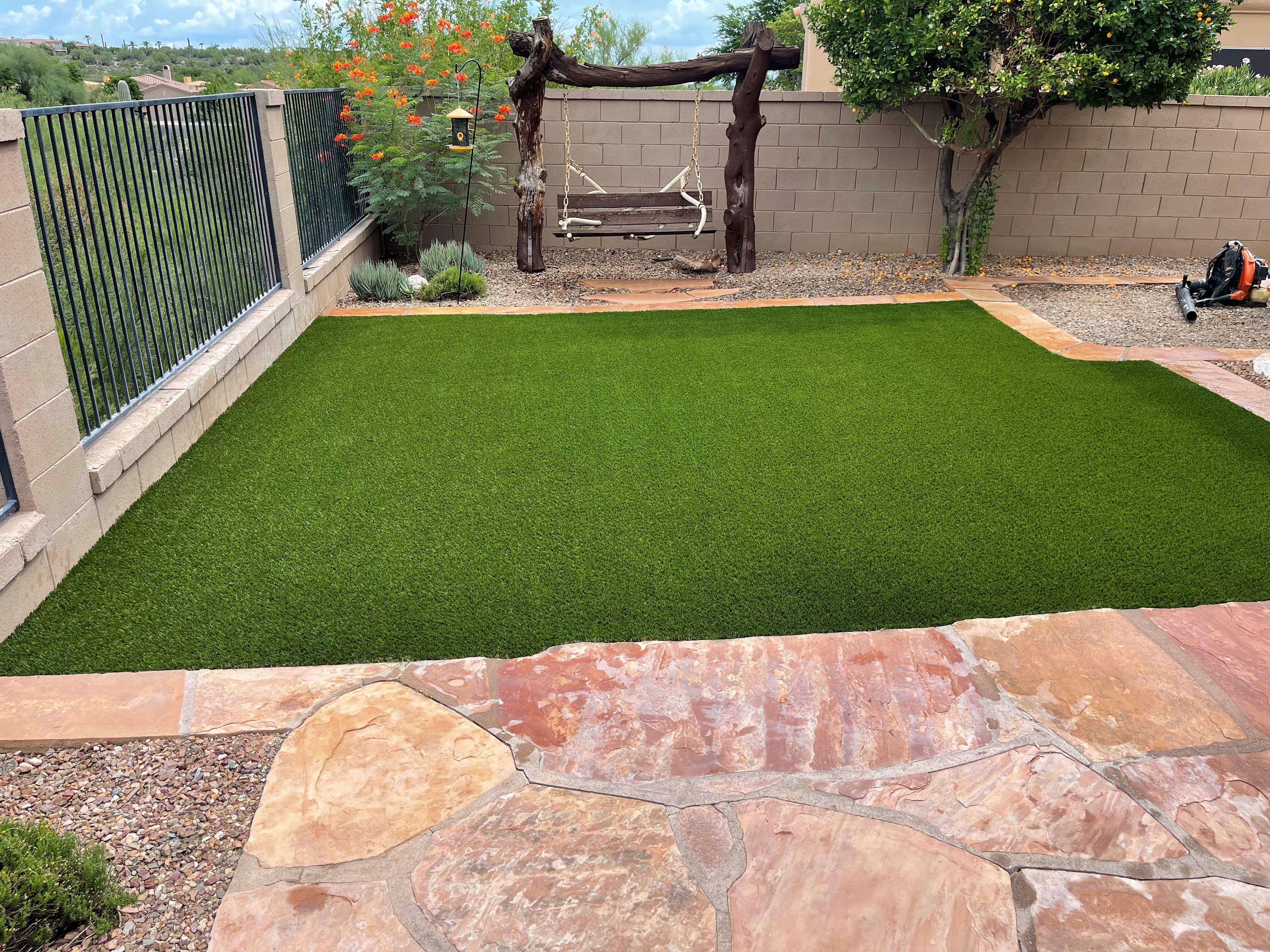 Residential synthetic grass landscape Tucson AZ low maintenance yard